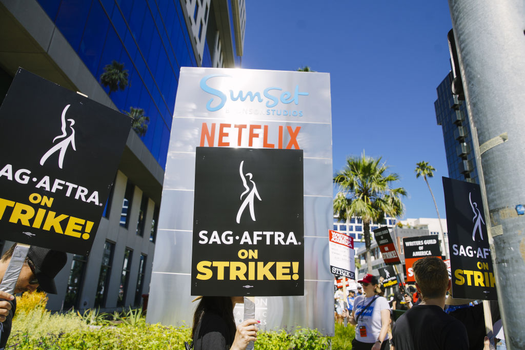 LOS ANGELES, CALIFORNIA - JULY 14: Actors in the SAG-AFTRA union join the already striking WGA union, film and tv writers on the picket line, on Day 3 of a SAG-AFTRA strike, in Los Angeles, CA, on July 14, 2023. 